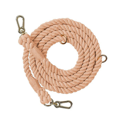 Blush Petal Nude colour 7ft multi-use rope dog lead coiled on white background, showing durable rope texture and metal clips