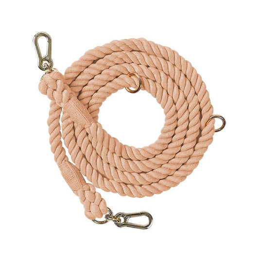 Blush Petal Nude colour 7ft multi-use rope dog lead coiled on white background, showing durable rope texture and metal clips