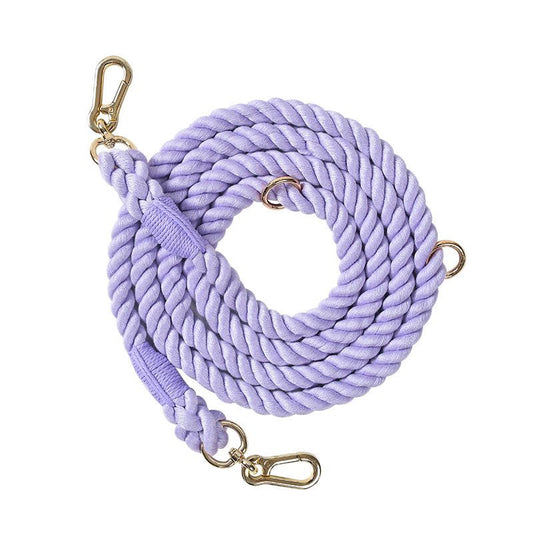 Lilac 7ft multi-use rope dog lead coiled on white background, showing durable rope texture and metal clips
