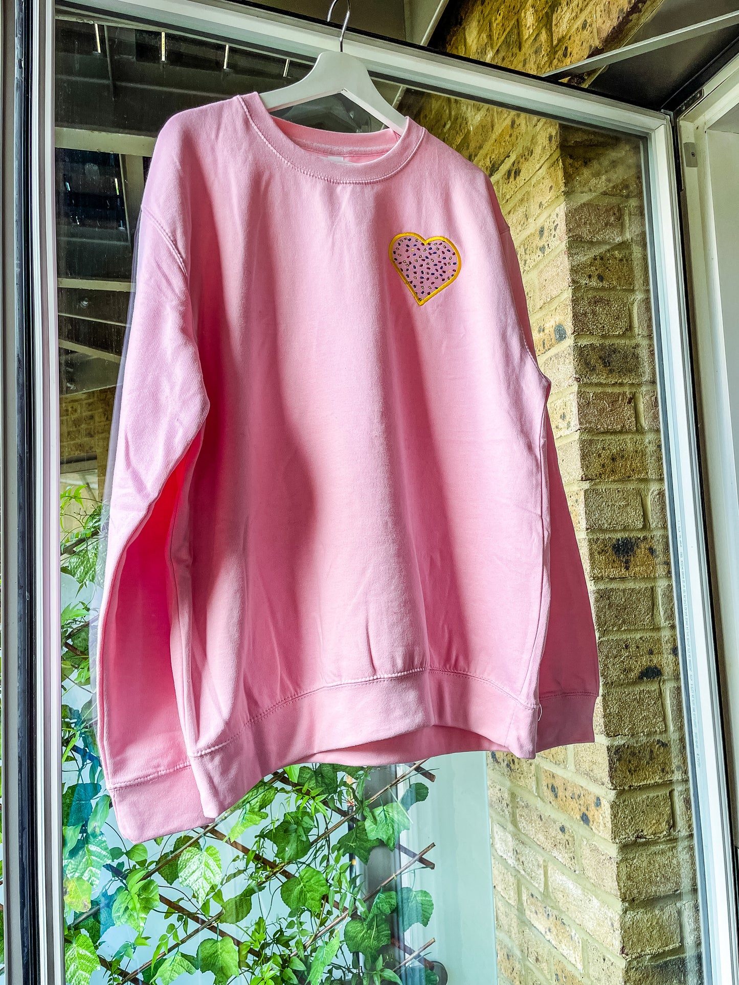 sprinkles for days pink embroidered hoodie